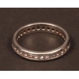Modern precious metal diamond full eternity ring, the band set with 30 small brilliant cut round