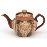 Macintyre teapot of tapering baluster form, decorated with a florian design in shades of brown and