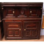 18th century oak court cupboard, initialled RF and dated 1727, projecting frieze hung at either