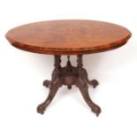 Victorian walnut oval tilt top loo table inlaid with boxwood panels of neo-classical foliage and