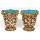 Pair of Copeland Majolica jardini res, of hexagonal form, each heavily moulded with masks and