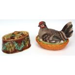 English Majolica oval tureen, typically moulded and decorated with game birds and floral garlands,