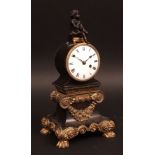 Late 19th century patinated and gilt bronze figural timepiece, the drum-shaped case surmounted by