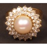 Modern pearl and diamond cluster ring, the feature central pearl (8.5mm dia app) surrounded by two