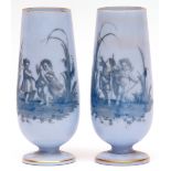 Pair of unusual, probably French, blue glass spill vases of circular pedestal form, decorated with