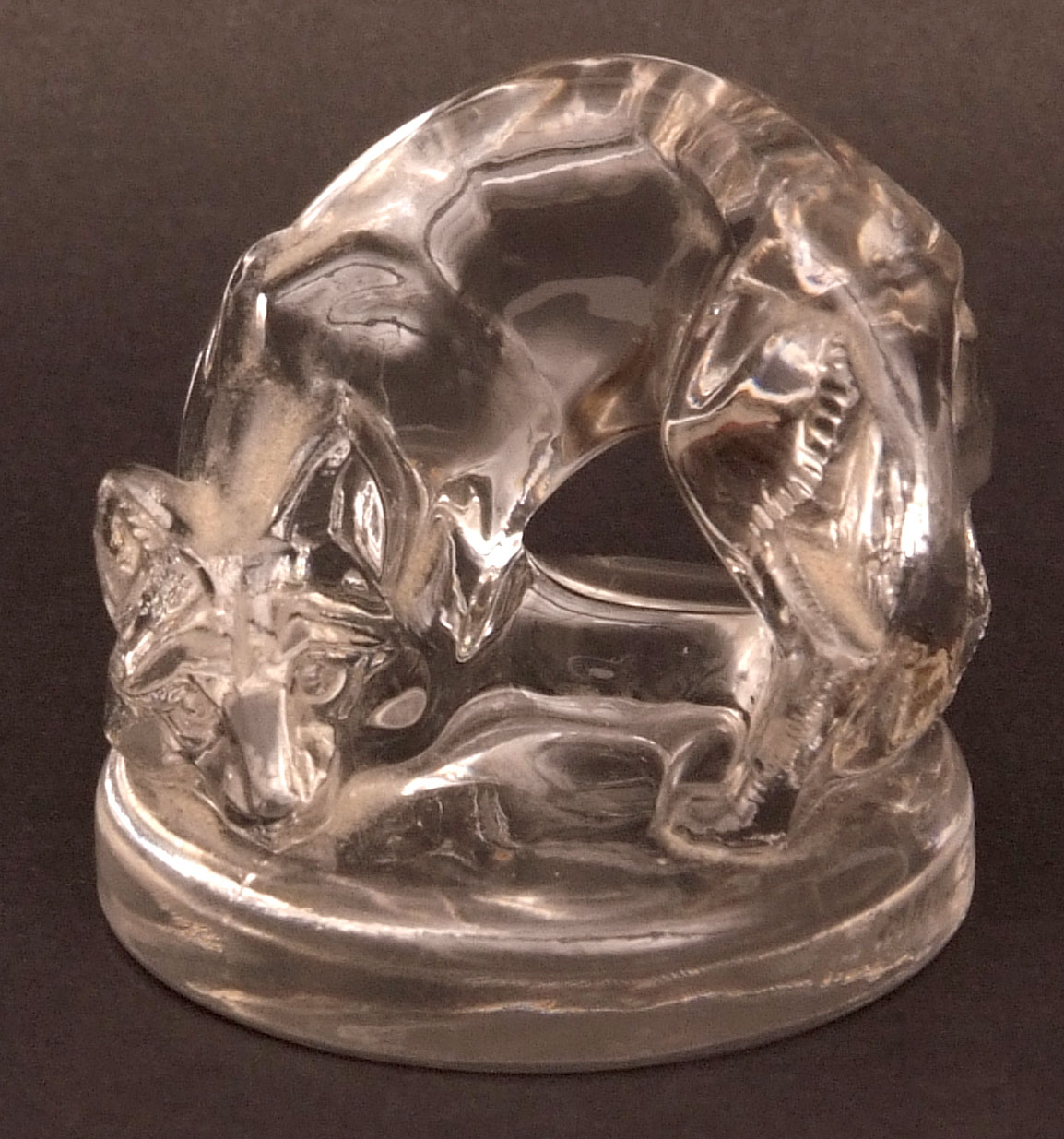 Lalique small paperweight, modelled as a curved fox, rim with acid etched mark R Lalique France, 1