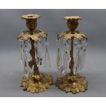 Pair of small gilt metal candle stands with glass prismatic drops, approx 9 1/2" high