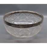 Heavy cut glass circular bowl with silver collar, 9" diameter (A/F)