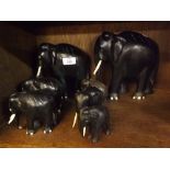 Collection of seven various ebony model elephants, largest 8" high