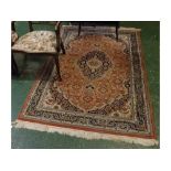 20th century machine made Persian rug decorated with central panel of lozenges and floral detail