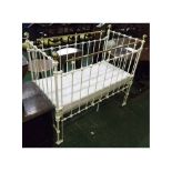 Victorian painted iron and brass child's cot with modern regulation foam mattress, 47" wide