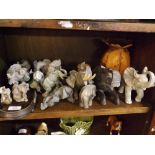 Collection of various small resin model elephants plus further wooden and stone examples