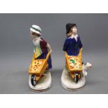 Pair of small fairing type figures of boy and girl with wheelbarrows, marked to plinth bases "