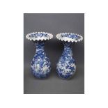 Pair of late 19th century Japanese blue and white vases with frilled rims (A/F)