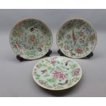 Set of three late 19th century Chinese Canton plates typically decorated with stylised flowers,