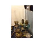 Mixed Lot: five assorted brass and glass oil lamps of varying designs