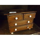 19th century stained wood small apprentice style four drawer chest, 8" wide