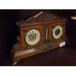 Late 19th or early 20th century French oak cased barometer/thermometer and clock combination, 12"