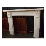 Large white painted wooden fire surround and mantel, 62" wide