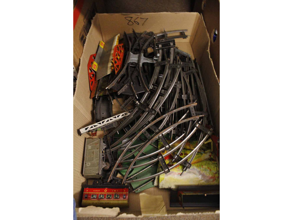 Box containing a quantity of metal 'O' gauge track and various accessories to include bridge,