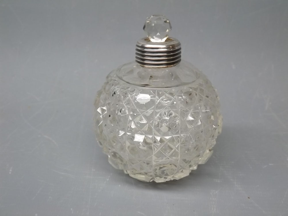 Spherical cut glass scent bottle with silver mount, complete with glass stopper (but lacking lid)