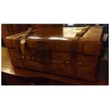 Large vintage tan leather travelling trunk, with copper rivets and two leather straps to top, with