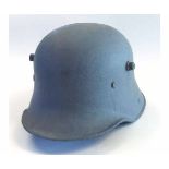 Mid-20th century German steel helmet with later grey painted finish (heavily corroded)