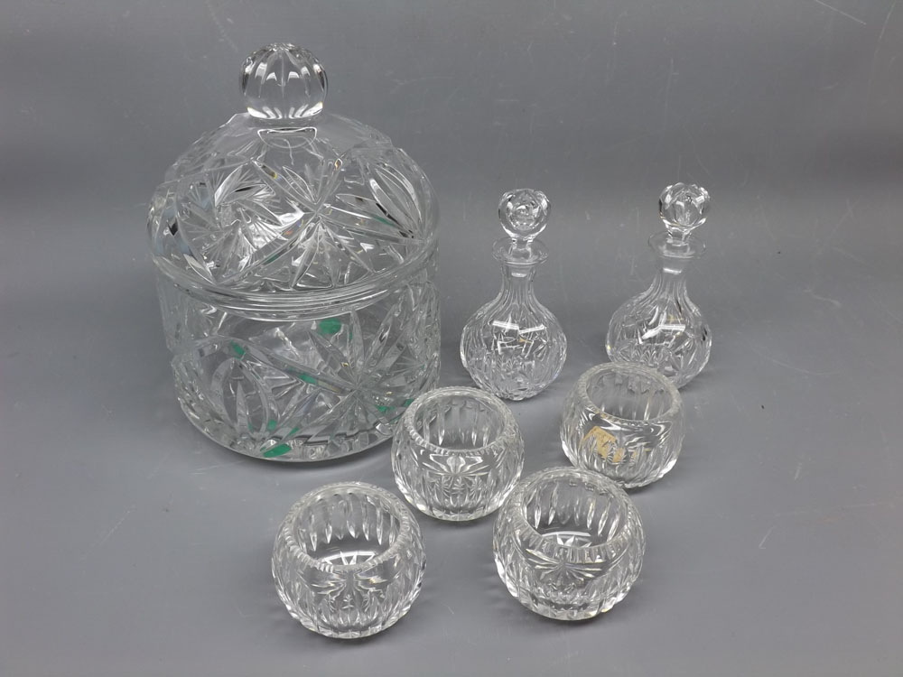 Pair of cut glass bottles with stoppers, 5" tall, together with a further set of four matching cut