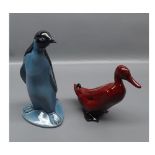 Royal Doulton flambe model of a duck together with a further Poole black and blue model of a