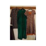 Two vintage ladies dresses with gold embroidery and geometric designs, together with a green full