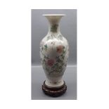 20th century Chinese baluster vase with floral decoration, four character marks to base, raised on