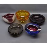 Five varying sized and coloured studio glass bowls to include Whitefriars glass bowl etc