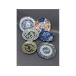 Group of six 19th/20th century Oriental plates with decorative scenes and varying sizes