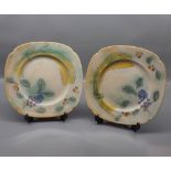 Pair of Royal Doulton plates designed by F Brangwyn, with a washed fruit design, 10" diameter