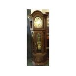 A late 20th Century Stained Oak and Glazed Floorstanding Clock, the one-piece case with