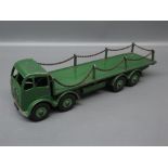 Dinky model of a Foden flatbed truck with chains and green body, Model No 905 (playworn)