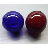 Two coloured glass decorative balls, 5" diameter