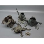 Four modern bronze frog ornaments, in varying poses, to include frog with fishing rod, seated frog