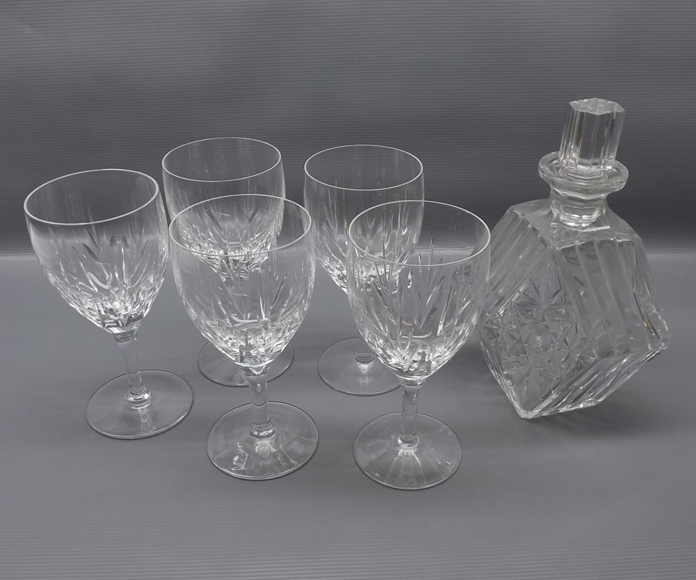 Set of five clear cut glass wine glasses, together with a further diamond stepped clear glass