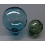 Two decorative coloured various sized glass balls