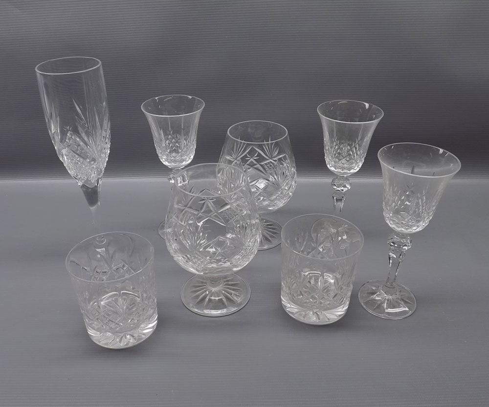 Group: twenty-one clear cut wine glasses comprising set of nine wine glasses, further smaller set of