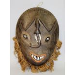 Large African mask with shell eyes and ivory teeth 20ins long