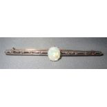 Opal bar brooch, set in yellow metal