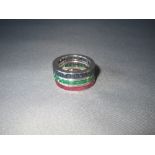 3 full eternity rings, sapphire, ruby and emerald, in white precious metal