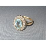 Diamond and aquamarine cluster ring, size R, set gold coloured metal