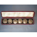 Set of gold coloured metal Japanese buttons, in fitted case