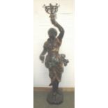 Blackamoor figural lamp base, she standing with hand aloft on shaped base 132 cm H