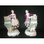 Pair of Samson Chelsea Derby style figures of a Gallant and lady selling fruit, dog at their side on