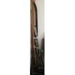 Collection of skis and poles and other items