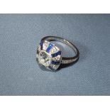 Sapphire and diamond ring old cusion cut diamond to an alternating surround of sapphires and